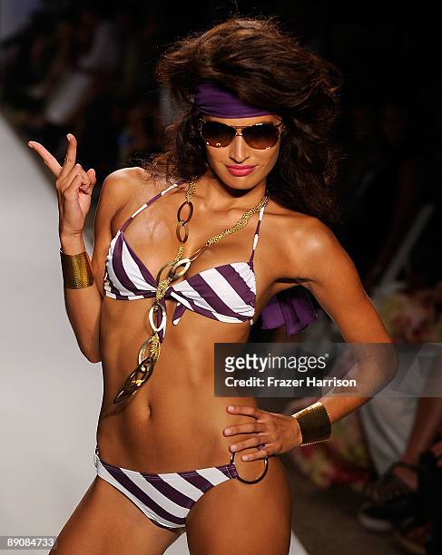 Model walks the runway at the L*Space by Monica 2010 fashion show during Mercedes-Benz Fashion Week Swim at the Cabana Grande at The Raleigh on July...