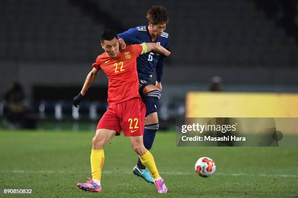 Yu Dabao of China and Genta Miura of Japan compete for the ball during the EAFF E-1 Men's Football Championship between Japan and China at Ajinomoto...