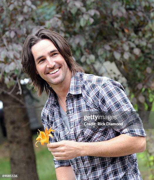 Singer/Songwriter Jake Owen checks out the local yellow flower while taping for GACTV backstage at the 17th Annual Country Thunder USA music festival...