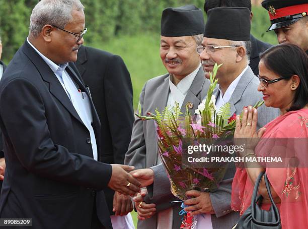 Nepalese Deputy Prime Minister Bijay Kumar Gachchhadar welcomes Prime Minister Madav Kumar Nepal upon Nepal's arrival at the Tribhuvan International...