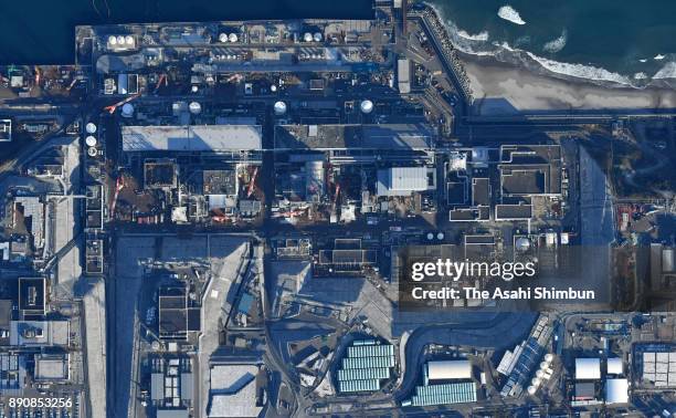 In this aerial image, damaged No. 1 to No.4 reactors are seen at Tokyo Electric Power Co 's Fukushima Daiichi Nuclear Power Plant on December 11,...