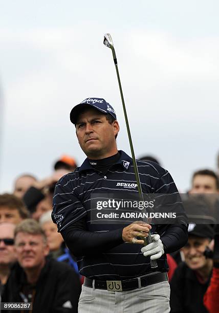 English golfer David Howell watches his drive on the 1st tee, on the third day of the 138th British Open Championship at Turnberry Golf Course in...