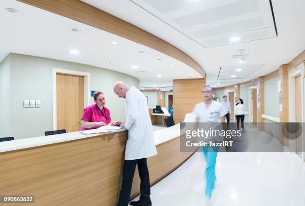 male doctor standing in hospital ward - archival hospital stock pictures, royalty-free photos & images