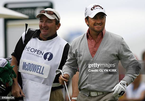 Northern Irish golfer Graeme McDowell stands on the 1st tee with his caddy, on the third day of the 138th British Open Championship at Turnberry Golf...