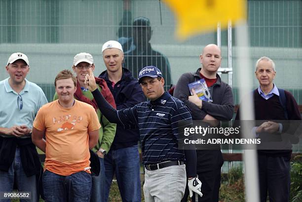 English golfer David Howell chips onto the 1st green, on the third day of the 138th British Open Championship at Turnberry Golf Course in south west...