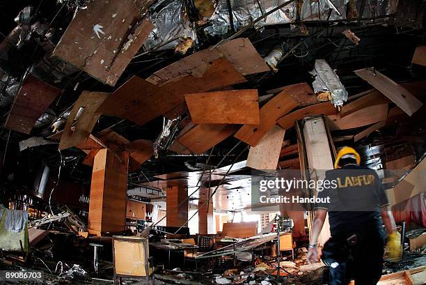 The damage inflicted by a bomb blast on a restaurant of the JW Marriot hotel is seen on July 18, 2009 in Jakarta, Indonesia. At least nine people,...