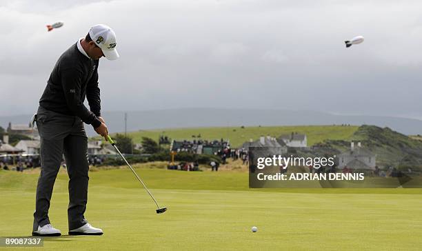 South African golfer Branden Grace putts on the 6th green, on the third day of the 138th British Open Championship at Turnberry Golf Course in south...