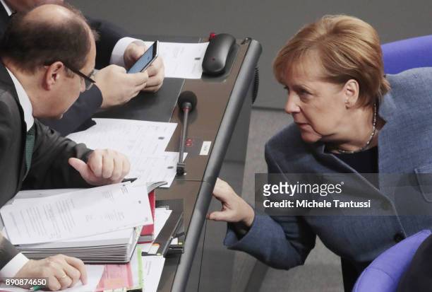 German Chancellor and leader of the German Christian Democrats Angela Merkel speaks with german Federal Minister of Food and Agriculture Christian...