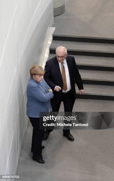 German Chancellor and leader of the German Christian Democrats Angela Merkel speaks with CDU Bundestag fraction head Volker Kauder at the Bundestag...