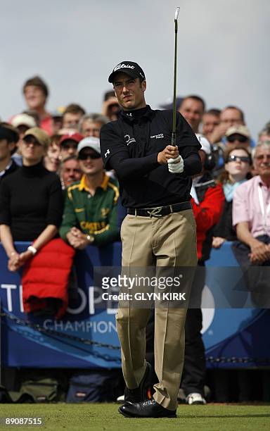 English golfer Ross Fisher tees off from the 1st tee, on the third day of the 138th British Open Championship at Turnberry Golf Course in south west...