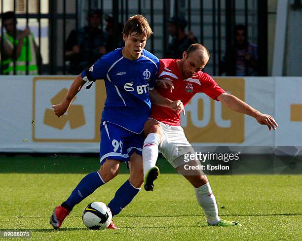 Aleksandr Kokorin of FC Dynamo Moscow battles for the ball with Gogita Gogua of PFC Spartak Nalchik during the Russian Football League Championship...