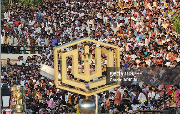 Indian nationals look on during the daily retreat ceremony at the India-Pakistan Wagah border on July 18, 2009. A rare meeting between the Indian and...