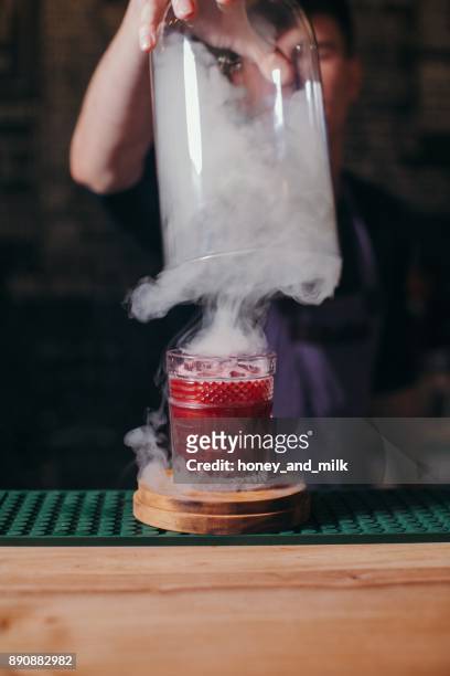 barman preparing a smoky cocktail - liquid nitrogen stock pictures, royalty-free photos & images