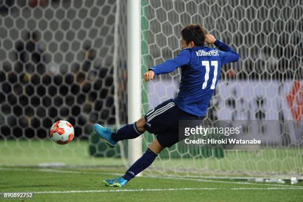Yu Kobayashi of Japan scores the opening goal during the EAFF E-1 Men's Football Championship between Japan and China at Ajinomoto Stadium on...