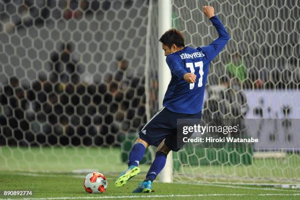 Yu Kobayashi of Japan scores the opening goal during the EAFF E-1 Men's Football Championship between Japan and China at Ajinomoto Stadium on...