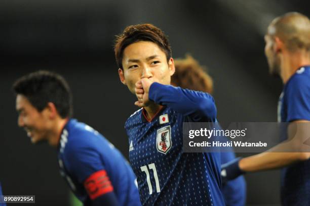 Yu Kobayashi of Japan celebrates scoring the opening goal during the EAFF E-1 Men's Football Championship between Japan and China at Ajinomoto...