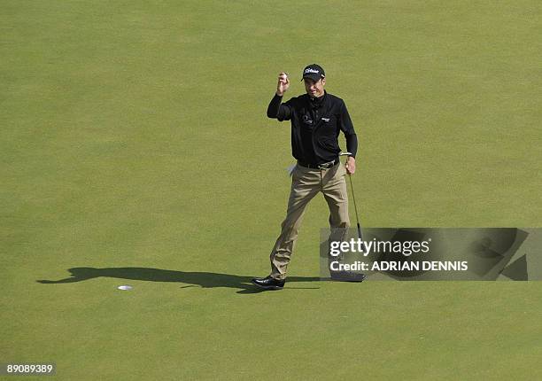 English golfer Ross Fisher acknowledges the crowd on the 7th green, on the third day of the 138th British Open Championship at Turnberry Golf Course...