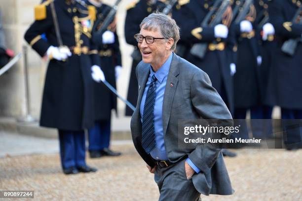 Bill Gates arrives for a meeting with French President Emmanuel Macron as he receives the One Planet Summit's international leaders at Elysee Palace...