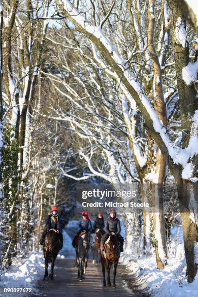 Simon Morgan returns to the stables of national hunt trainer Fergal O'Brien riding A Wee Minute after working out in heavy snow conditions during...