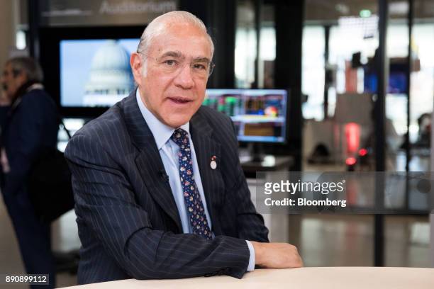 Angel Gurria, secretary-general of the Organization for Economic Cooperation and Development , poses for a photograph ahead during a Bloomberg...
