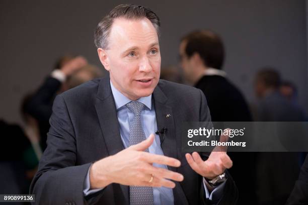 Thomas Buberl, chief executive officer of AXA SA, gestures while speaking during a Bloomberg Television interview at the One Planet Summit in Paris,...