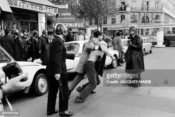 Policemen, member of the CRS, arrest demonstrators in Rivoli street, during a demonstration on May 6, 1968. The demonstrations, which were banned,...