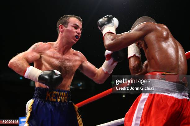 Kevin Mitchell attacks Rudy Encarnacion during their Super Featherweight contest on July 18, 2009 at the MEN Arena in Manchester, England.