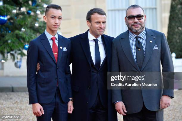 French President Emmanuel Macron welcomes Mohammed VI of Morocco and Moulay Hassan, Crown Prince of Morocco as the arrive for a meeting for the One...