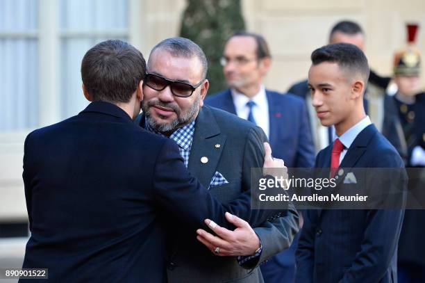 French President Emmanuel Macron welcomes Mohammed VI of Morocco and Moulay Hassan, Crown Prince of Morocco as the arrive for a meeting for the One...