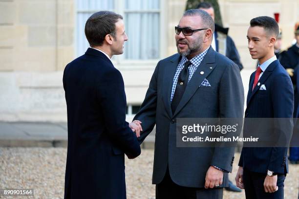 French President Emmanuel Macron welcomes Mohammed VI of Morocco and Moulay Hassan, Crown Prince of Morocco as the arrive for a meeting for the One...
