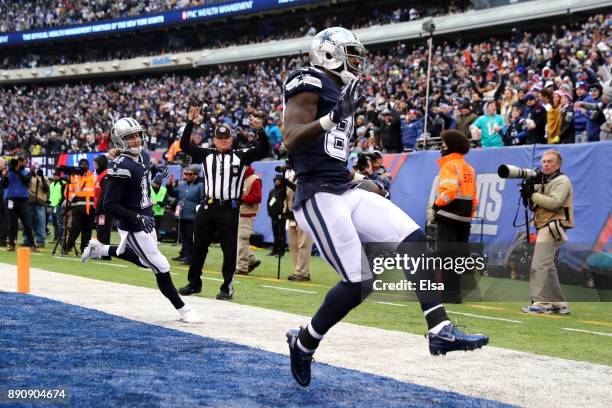 Dez Bryant of the Dallas Cowboys celebrates after scoring a 50 yard touchdown against the New York Giants during the fourth quarter in the game at...