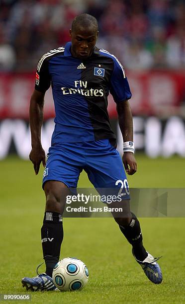 Guy Demel of Hamburg runs with the ball during the T-Home cup match between FC Bayern Muenchen and Hamburger SV at the Veltins Arena on July 18, 2009...