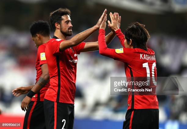 Yosuke Kashiwagi of Urawa Reds celebrates scoring his team's second goal with Mauricio Antonio during the FIFA Club World Cup UAE 2017 fifth place...