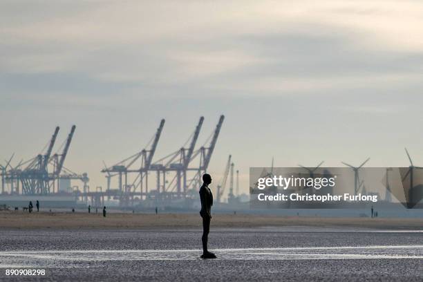 Statue at Antony Gormley's art installation 'Another Place' at Crosby Beach, stands in the sand on November 12, 2017 in Liverpool, England.