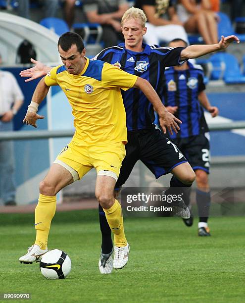 Pyotr Nemov of FC Saturn Moscow Oblast battles for the ball with Branimir Petrovic of FC Rostov, Rostov-on-Don during the Russian Football League...