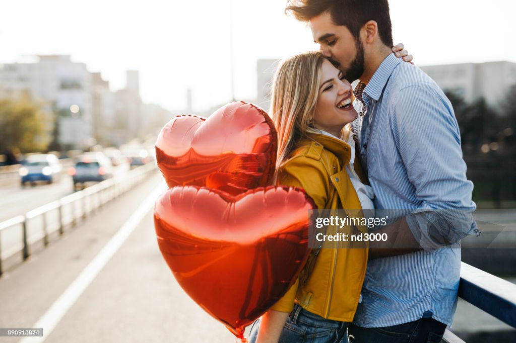 Romantic young couple in love, hugging on the street