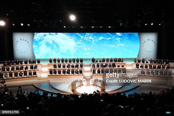 World leaders pose at the start of the One Planet Summit on December 12 at La Seine Musicale venue on the ile Seguin in Boulogne-Billancourt,...