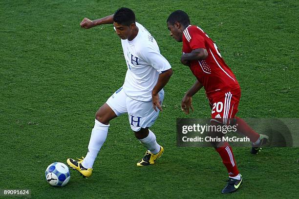 Melvin Valladares of Honduras contests the ball with Patrice Bernier of Canada during their CONCACAF quarterfinal match at Lincoln Financial Field on...