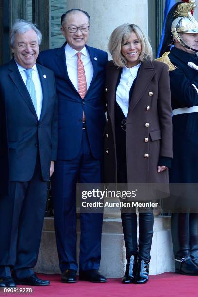 Antonio Guterres, Secretary General of the United Nations, President of the World Bank Jim Yong Kim and French First Lady Brigitte Macron react as...