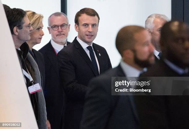 Emmanuel Macron, France's president, center, arrives at the One Planet Summit in Paris, France, on Tuesday, Dec. 12, 2017. Macron hosts at least four...