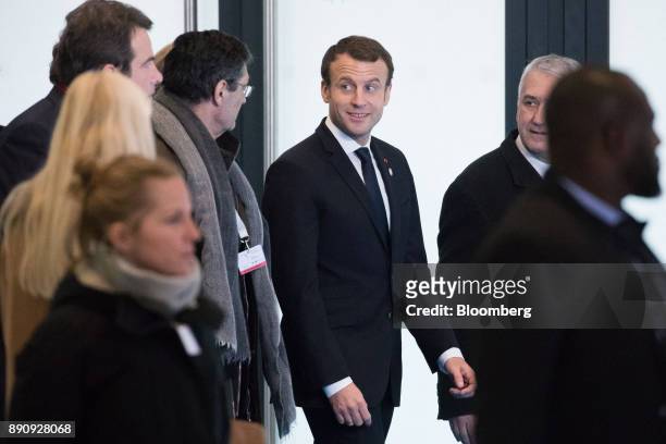 Emmanuel Macron, France's president, center, arrives at the One Planet Summit in Paris, France, on Tuesday, Dec. 12, 2017. Macron hosts at least four...