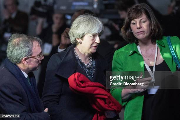 Theresa May, U.K. Prime minister, center, arrives at the One Planet Summit in Paris, France, on Tuesday, Dec. 12, 2017. French President Emmanuel...