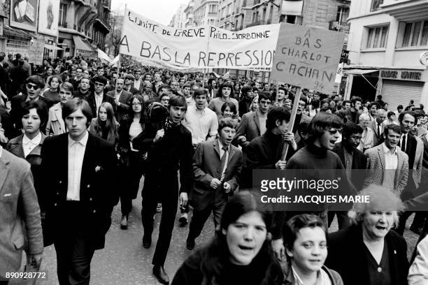 Students walk under the banner "Down with repression" during the demonstration of May 13, 1968 in Paris - Demonstrator march 13 May 1968 in Paris at...