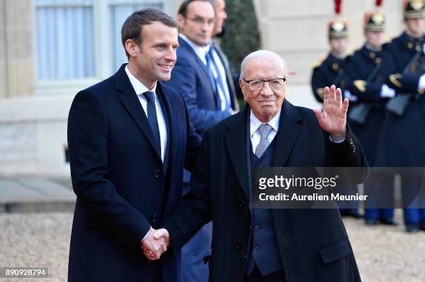 French President Emmanuel Macron welcomes President of Tunisia, Beji Caid Essebsi as he arrives for a meeting for the One Planet Summit's...