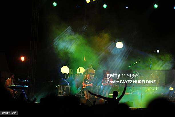 Algerians attend a music rally for the Algerian Rab singer Chab Belal in front of the "unknown soldier" memorial in Algiers on July 18, 2009 during...