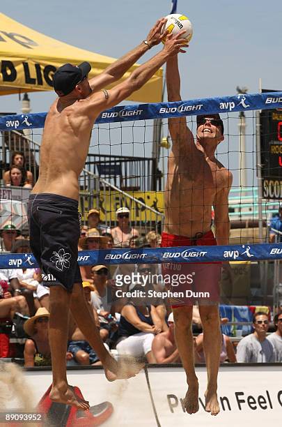 Phil Dalhausser contends for the ball with Casey Jennings at the AVP Crocs Manhattan Beach Open on July 18, 2009 in Manhattan Beach, California. Phil...