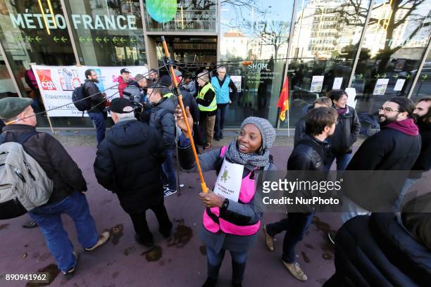 Weather technicians of French national meteorological service Meteo France gather in front of the compagnys headquarters against the abolishment of...