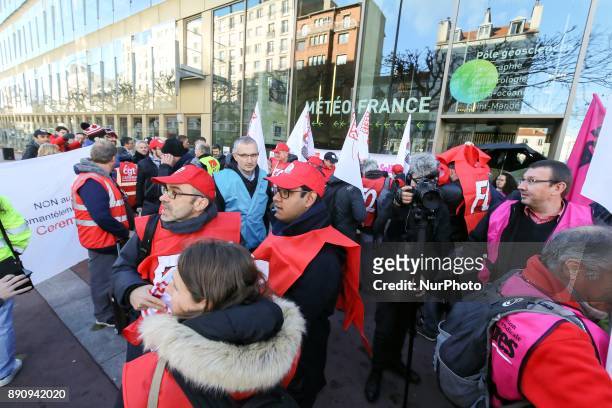 Weather technicians of French national meteorological service Meteo France gather in front of the compagnys headquarters against the abolishment of...