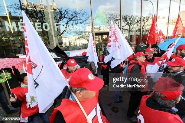 Weather technicians of French national meteorological service Meteo France gather in front of the compagnys headquarters against the abolishment of...