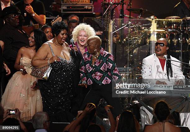 Lil Kim, Aretha Franklin, Cyndi Lauper, Angelique Kidjo and Stevie Wonder perform during the Mandela Day: A 46664 Celebration Concert at Radio City...